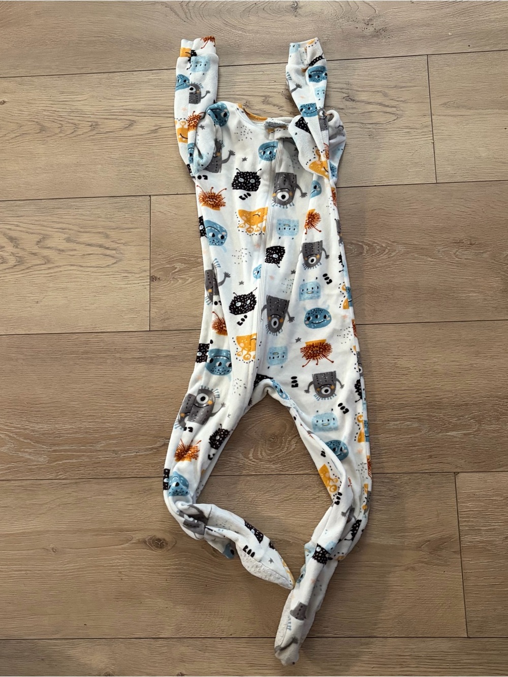 Long Sleeve Knotted Footless One-Piece in White with Blue & Yellow Animal Print